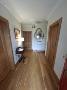 an empty room with a table and a mirror on the wall at Teach Kitty Con in Dungloe