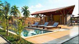 a swimming pool with lounge chairs next to a house at Aconchego Atalaia in Luis Correia