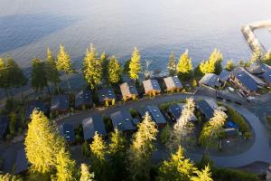 an aerial view of a resort complex by the water at JDF Waystation Cabin - Garden View - Pet Friendly in Port Renfrew