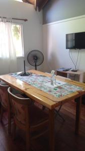 a wooden table with a fan on top of it at Apartamento céntrico Campana in Campana