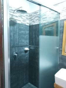a shower with a glass door in a bathroom at Hotel Ruah in Tumbes +12 photos