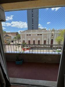 a view of a building from a balcony at Apto Pet Friendly com Ar condicionado no Centro in Bagé