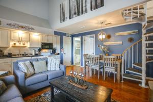 a living room with a couch and a table at Steps to Brigantine Beach: New Jersey Beach Condo in Brigantine
