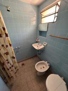 a bathroom with a toilet and a sink at Chalet Doña Ines in Cuesta Blanca +11 photos
