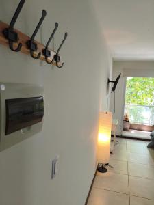 a hallway with a lamp and a light on a wall at Alojamiento Premium en Pichincha in Laprida