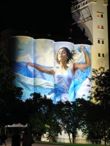 a large building with a woman painted on it at Alojamiento Premium en Pichincha in Laprida