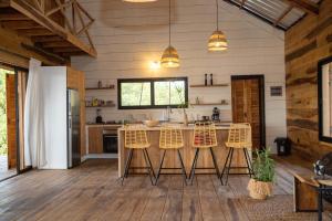 a kitchen with a table and chairs in a room at Villa Aïdo in Ouidah