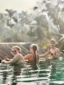 a group of people in a swimming pool at Sinharaja Forest Sanctuary in Deniyaya