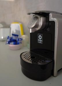 a coffee maker sitting on top of a counter at Monolocale City Station in Brindisi