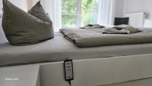 a bed with two pillows sitting on top of it at Sternenhimmel in Lenz +6 photos