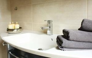 a bathroom with a sink with towels on it at Sonnenschein in Lenz
