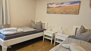 a bedroom with a bed and a desk with a lamp at Andreas in Lenz
