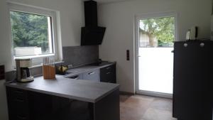 a kitchen with a counter top and a refrigerator at Haus Phil in Lenz