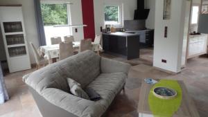 a living room with a couch and a table at Haus Phil in Lenz