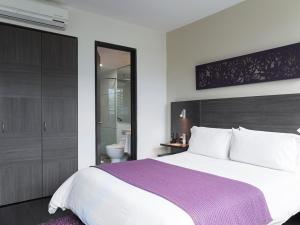 Voodi või voodid majutusasutuse Hotel bh El Poblado toas