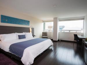 Voodi või voodid majutusasutuse Hotel bh El Poblado toas