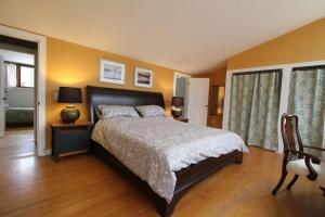 a bedroom with a bed and a chair at Fiber Artist's Studio in Woodstock