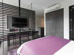 Voodi või voodid majutusasutuse Hotel bh El Poblado toas