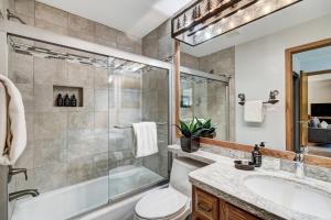a bathroom with a shower and a toilet and a sink at Townsend Place, A Vail Resorts Property in Beaver Creek +103 photos