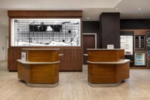 a store with wooden counters and a large window at Courtyard by Marriott New York Manhattan Upper East Side in New York