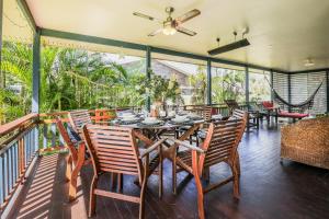 a dining room with a table and chairs at On Agnes Time • Beach House for 10 • BBQ Deck • Walk to Beach in Agnes Water