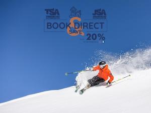 a man is skiing down a snow covered slope at Ironmongie 1 JackFrost in Thredbo