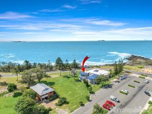 an aerial view of a house and the ocean at The Hideaway in Emu Park