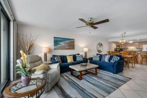 a living room with a couch and a table at Perdido Quay 501 by Youngs Suncoast in Orange Beach