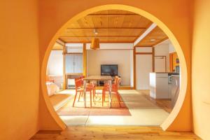 a kitchen and dining room with a table and chairs at Address Nozawa in Nozawa Onsen +30 photos