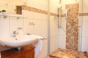 a bathroom with a sink and a shower at Gerdemann in Timmendorf
