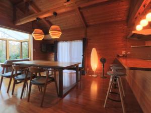a dining room with a table and chairs at La villetta 白浜 in Minamiboso +38 photos