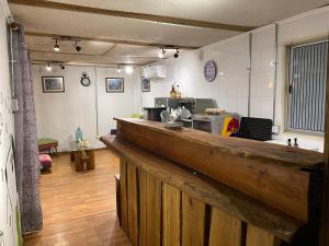 a kitchen with a long counter in a room at Departamento Terraza in Molina