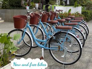 a row of bikes parked in a row with baskets at Hoi An Odyssey Hotel & Spa in Hoi An +148 photos