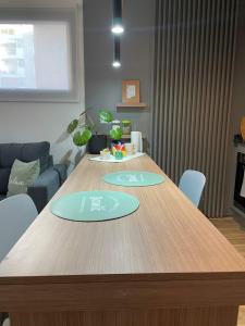 a wooden table with two circles on it in a living room at Rosario SJ Loft Studio in Rosario