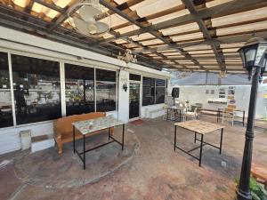 a room with two tables and chairs and a train at Khao Ban Eings in Sena