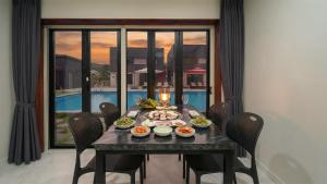 a table with food on it in a dining room at Gapyeong Orion PoolVilla pension in Gapyeong