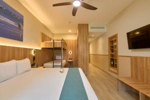 a bedroom with a bed and a ceiling fan at Casa Andina Select Zorritos Tumbes in Zorritos +166 photos