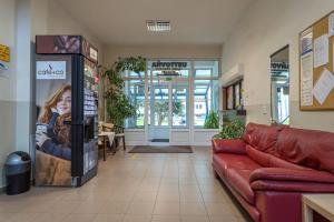 a living room with a couch in a store at Hostel Turist in Zvolen