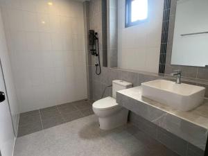a bathroom with a white toilet and a sink at Pool villa Cream Darin in Ban Hua Phrong +12 photos
