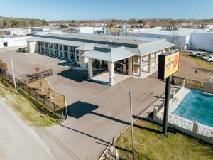an overhead view of a building with a swimming pool at Super 8 by Wyndham Jackson MS Near the Fairgrounds in Jackson