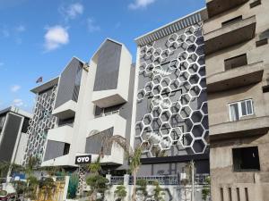 a rendering of a building with a geometric facade at Hotel IVY in New Delhi