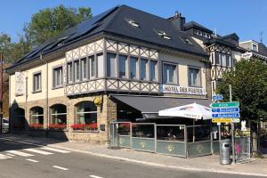 a building on the corner of a street at Hotel des Postes in Houffalize