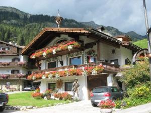 a woman standing in front of a building at bruno piller hoffer in Sappada