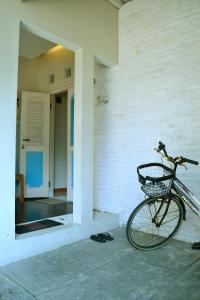 a bike parked on the side of a house at Cipta Guesthouse in Yogyakarta