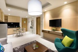 TV a/nebo společenská místnost v ubytování Watergate Boutique Hotel
