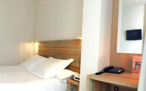 Łóżko lub łóżka w pokoju w obiekcie Hotel Boutique Elvira Plaza