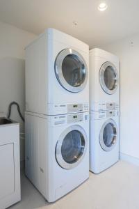 two washing machines are stacked next to each other at Greenlane Motel in Auckland