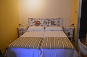 Voodi või voodid majutusasutuse Albergo La Pace toas