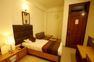 Postel nebo postele na pokoji v ubytování Hotel Parkway Deluxe