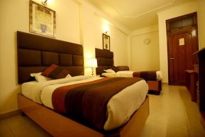 Postel nebo postele na pokoji v ubytování Hotel Parkway Deluxe